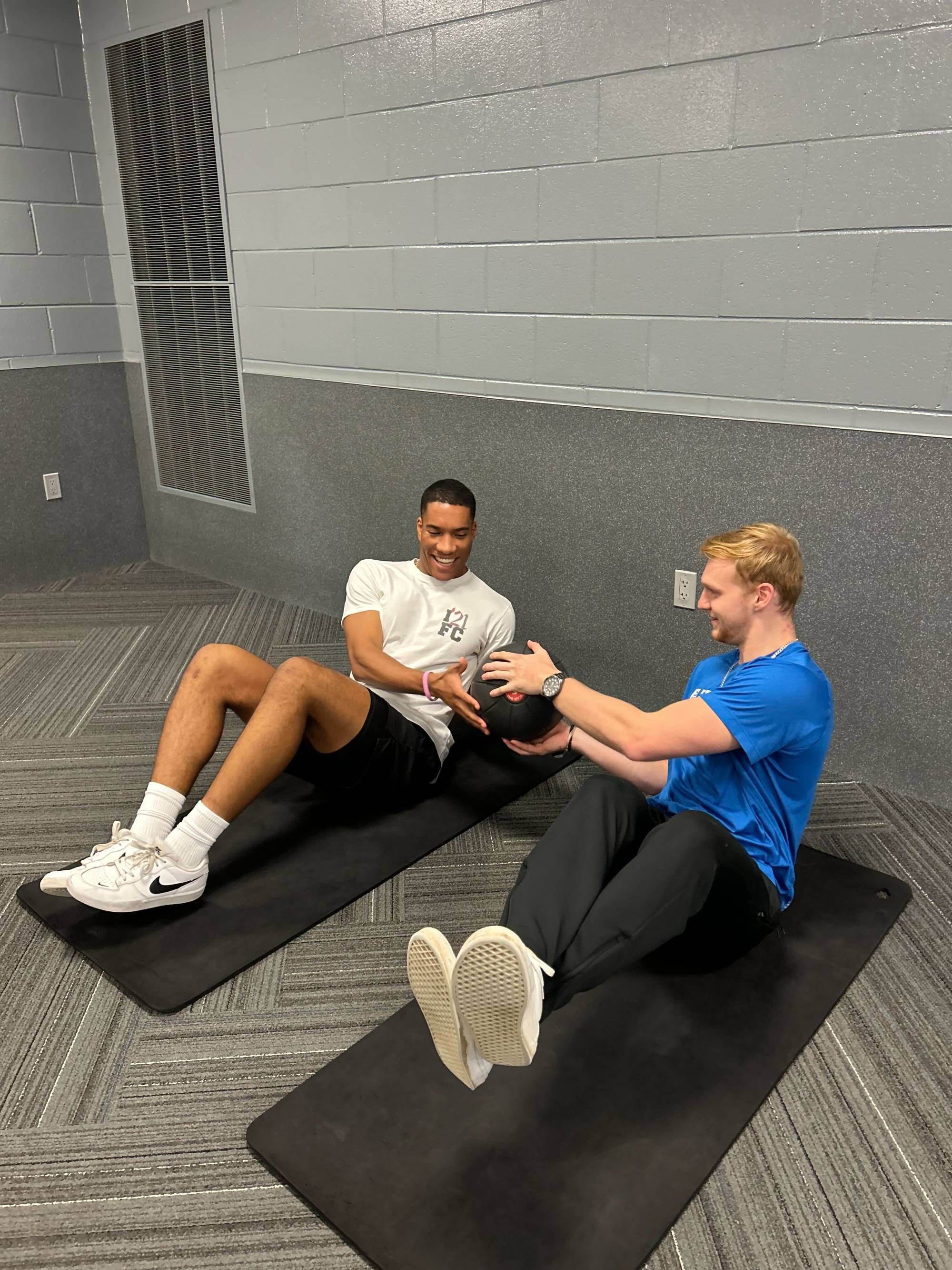 Trainer and client working on core